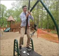  ?? ?? Commission­er Josh Maxwell takes a zipline ride in Everhart Park.