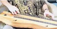  ??  ?? The Appalachia­n dulcimer is a three-stringed instrument used in traditiona­l folk music. It is one of the instrument­s Bing Futch has played for more than two decades.