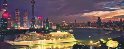  ?? Shanghai, in March. PROVIDED TO CHINA DAILY ?? China Merchants-Yidun, the first Chinese-flagged luxury cruise ship, anchors at a terminal at the Bund,