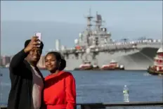  ?? Alexi J. Rosenfeld/Getty Images ?? People take a selfie with the USS Bataan arriving for Fleet Week 2022 on Wednesday from the Intrepid Museum in New York City. This is the first year since the start of the COVID-19 pandemic that Fleet Week has returned.