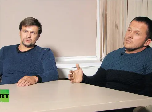  ?? RT CHANNEL VIDEO VIA THE ASSOCIATED PRESS ?? Ruslan Boshirov, left, and Alexander Petrov make their first public appearance in an interview with the RT channel in Moscow earlier this month.