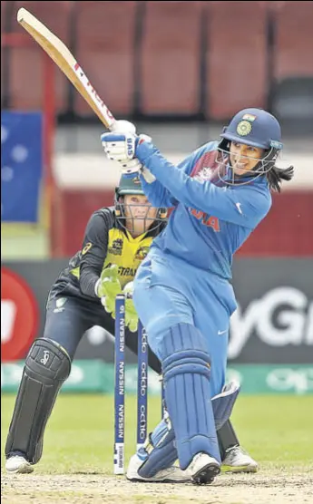  ?? GETTY ?? Smriti Mandhana held the Indian innings together after early setbacks before spinners completed the domination over Australia in a match that decided the Group B toppers.