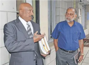  ?? Photo: Fonua Talei ?? Lawyer Damodaran Nair (left) and Fiji Teachers Union (FTU) general secretary Agni Deo Singh outside the High Court in Suva on July 3, 2018.