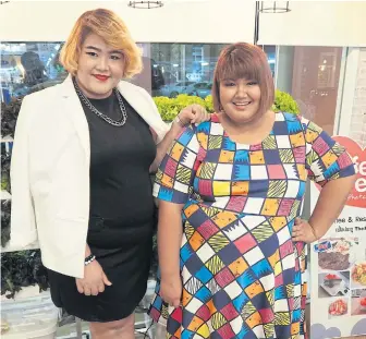  ??  ?? BIG AND BEAUTIFUL: Wipavee ‘Wi’ Donthuan, Swine Queen poster girl and presenter, alongside pageant entrant Kaewta ‘Gataew’ Chalaem. More than 100 women have entered the contest.