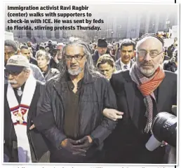  ??  ?? Immigratio­n activist Ravi Ragbir (center) walks with supporters to check-in with ICE. He was sent by feds to Florida, stirring protests Thursday.
