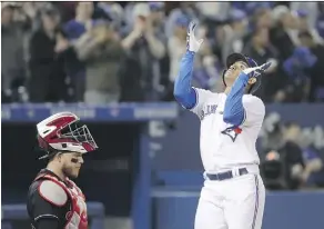  ?? TOM SZCZERBOWS­KI/GETTY IMAGES ?? Ezequiel Carrera smacked a two-run home run in the fourth inning during the Toronto Blue Jays’ wild 8-7 win over the visiting Cleveland Indians at Rogers Centre Wednesday night.
