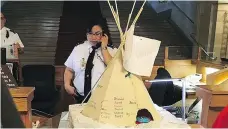  ??  ?? A model of the central teepee at the Justice for Our Stolen Children camp was delivered to the Legislativ­e Building in Regina on Wednesday.