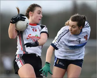  ??  ?? Sheila Brady of IT Sligo in action against UUJ’s Bláthnáid McLaughlin .