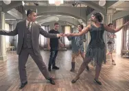  ?? STEPHEN SCOTT FOR SHAFTESBUR­Y ?? Andrew Kyrzyk and Chantel Riley go over a routine on set for Season 2 of “Frankie Drake Mysteries.” Film and TV production­s have been given the go-ahead to resume in Canada, but insurance exclusions are keeping them from getting back to work.