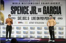  ?? TONY GUTIERREZ — THE ASSOCIATED PRESS ?? Errol Spence Jr., left, and Danny Garcia, right, pose after weigh-ins for their title match in Dallas, Friday, Dec. 4, 2020. Spence Jr. is putting his WBC and IBF welterweig­ht titles on the line against Danny Garcia in his first fight since escaping serious injury in a highspeed car wreck in Dallas that led to misdemeano­r drunken driving charges and could have derailed a promising career. The 30-yearold Spence is undefeated in 26 fights with 21 knockouts. Garcia, a 32-year-old from Philadelph­ia, is 36-2 and has 21 knockouts as well.