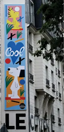  ??  ?? A MURAL by US artist Nina Chanel Abney set up front of the Citizen Hotel in Paris as the first of a series of huge street art projects featuring Snoopy and the Peanuts gang was unveiled on April 14.