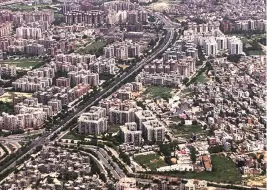  ?? PHOTO: REUTERS ?? Buildings and roads are seen from an airplane flying over New Delhi. The city government’s notificati­on to declare 89 rural villages as urban will help authoritie­s to develop infrastruc­ture projects in such localities and make housing more affordable