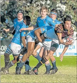  ?? Picture: MARK WEST ?? GOT HIM: Grey High’s Waqar Solaan tackles Daniel Pienaar’s Dylan La Roux during their match at Grey at the weekend