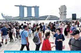  ??  ?? SINGAPORE: Photo shows a crowd of people visiting central Singapore’s iconic promenade. Those in Singapore with HIV-the virus that causes AIDS-have long complained of prejudice, and campaigner­s say a data breach of some 14,200 people, whose HIV status was released on the internet in January 2019, has caused widespread consternat­ion. — AFP