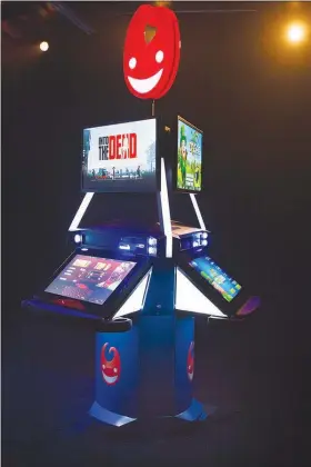  ?? COURTESY OF GAMBLIT GAMING ?? Gamblit Gaming this week unveiled Tristation, a pod containing three interactiv­e gaming stations, at Planet Hollywood. Six skill-based games, including “Into the Dead,” are available on each Tristation.