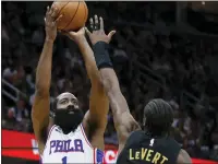  ?? RON SCHWANE — THE ASSOCIATED PRESS ?? James Harden, left, shoots over Cleveland’s Caris LeVert during the second half on Wednesday in Cleveland.