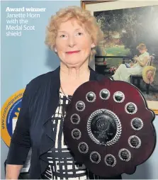  ??  ?? Award winner Janette Horn with the Medal Scot shield