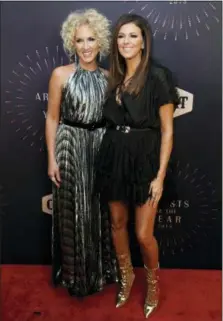  ??  ?? Honorees Karen Fairchild, left, and Kimberly Schlapman arrive at the 2018 CMT Artists of the Year show held at the Schermerho­rn Symphony Center on Wednesday, Oct. 17, 2018, in Nashville, Tenn.