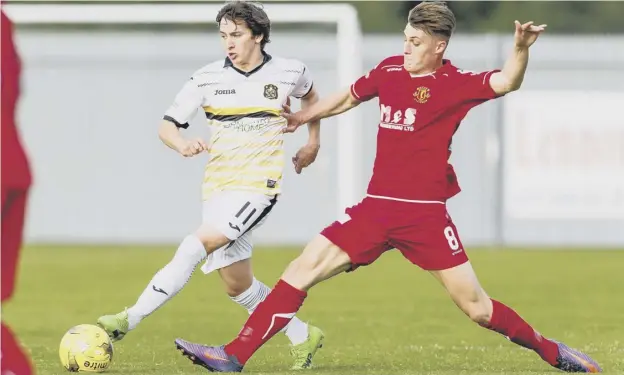  ??  ?? 0 Dumbarton’s Chris Johnston, left, holds off Annan’s Owen Moxon during their Group E stalemate at The YOUR Radio 103FM Stadium with Annan winning 4-3 on penalties.