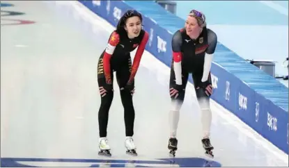  ?? AP / AFP ?? Ahenaer Adake of China (left) and Claudia Pechstein of Germany greet each other after their heat of the women’s speed skating 3,000m event at the Beijing 2022 Olympic Winter Games at the National Speed Skating Oval on Feb 5.