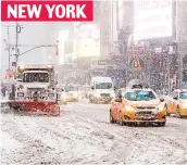  ??  ?? Gridlock: Snow storm in Times Square NEW YORK