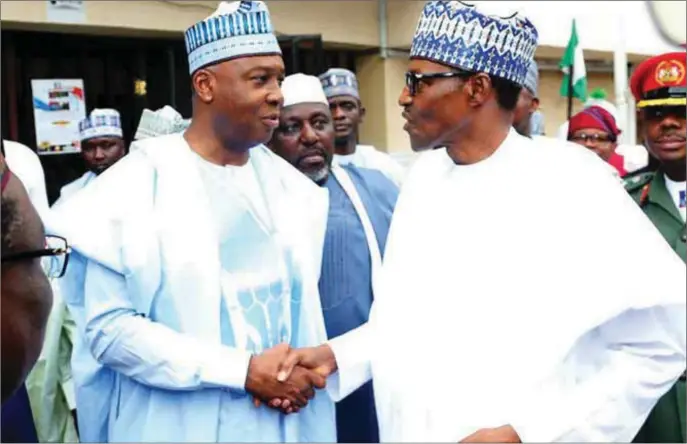  ??  ?? Buhari and Saraki in a warm handshake before the renewed onslaught