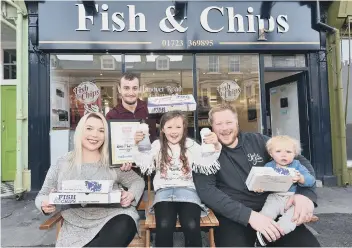  ??  ?? Celebratin­g winning second place – before the terrible fire at Hanover Road Fish &amp; Chips – are employee Leon, with Katrice Rowe and Alice and Axel Rowe Miller, and Will Miller. 184611