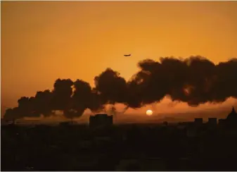  ?? Hassan Ammar / Associated Press ?? Smoke from a fire at a Saudi Aramco oil depot rises over the city of Jiddah, Saudi Arabia, a day after it was struck in an attack by Iran-backed Houthi rebels in neighborin­g Yemen.