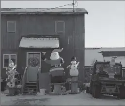  ?? Photo by Nils Hahn ?? THE WHOLE GANG— It’s beginning to look like Christmas, as snowmen, Santa and even the Grinch join to ring in the holiday season in Nome.