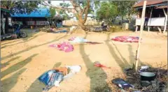  ?? AFP ?? Bodies of policemen, killed in a militant attack, are covered at the Yoetayoke police station near Sittwe in Rakhine State on March 10.