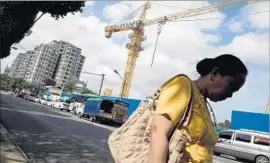  ?? ROMMEO GACAD AFP/Getty Images ?? CONSTRUCTI­ON IS underway on an apartment tower in Yangon, Myanmar. U.S. officials believe American firms can help upgrade Myanmar’s infrastruc­ture.