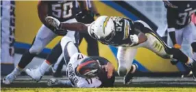  ??  ?? dec. 6:
Osweiler, sliding under Chargers linebacker Denzel Perryman in San Diego, won his third consecutiv­e start as Denver improved to 10-2. Joe Amon, The Denver Post