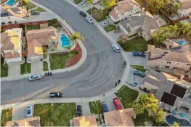  ??  ?? ‘I am happy to inform all of the people living their Suburban Lifestyle Dream that you will no longer be bothered or financiall­y hurt by having low income housing built in your neighborho­od.’ Photograph: Bonandbon/Alamy