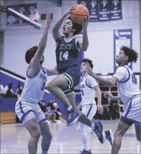  ?? JESUS ‘JQ’ QUESADA III PHOTO ?? Vincent Memorial Scot Francisco Perez-Tejada (14) goes up for a shot against the Central Spartans during a non-league boys basketball game on Thursday, January 5, at Spartan Arena in El Centro.