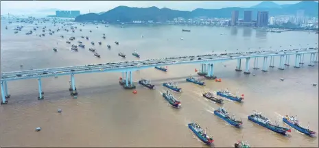  ?? Photo: VCG ?? A fleet of fishing boats sets off from the Shenjiamen port in Zhoushan, East China’s Zhejiang Province on August 1, 2022 to start a new round of fishing in the East China Sea as the off- season ends.