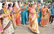  ??  ?? — P. SURENDRA TRS women party workers dance during the Rajya Sabha candidate nomination­s at Gun Park in Hyderabad on Monday.