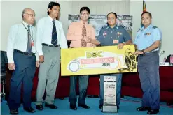  ??  ?? BoC Chief Marketing Officer Indunil Liyanage handing over the sponsorshi­p to Air Commodore Sanjaka Wijemanna in the presence of Chief Manager Marketing D.N. De Soyza (left), Assistant Manager Marketing A. Niriella and SLAF Group Captain Hemantha Soysa