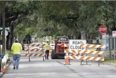  ?? AP photo ?? A city street is seen closed for repairs and upgrades Thursday in Orlando, Fla. As part of an infrastruc­ture proposal by the Biden administra­tion, $115 billion is earmarked to modernize the bridges, highways and roads that are in the worst shape.