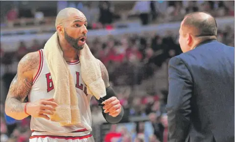  ?? | SUN-TIMES MEDIA ?? Bulls forward Carlos Boozer is upset with coach Tom Thibodeau about his playing time in the fourth quarter.