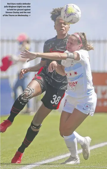  ?? AP ?? Red Stars rookie defender Julia Bingham (right) was able to hold her ground against Simone Charley and the rest of the Thorns on Wednesday.