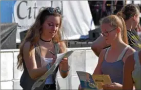  ?? DIGITAL FIRST MEDIA FILE PHOTO ?? Douglassvi­lle’s own Stephanie Grace, the first opening act at Citadel Palooza in Pottstown Oct. 7, signs autographs for fans who waited beside the stage to meet her. Grace, along with several other local performers, opened for headliner Hunter Hayes....