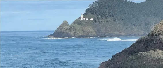  ?? KIM PEMBERTON PHOTOS ?? A view of the Heceta Head Lighthouse, one of 11 lighthouse­s on the Oregon Coast, from the Sea Lion Caves, a popular tourist attraction since 1932.