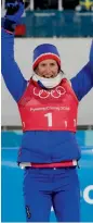  ?? AP ?? Marit Bjoergen of Norway celebrates after winning the bronze medal in the women’s team sprint freestyle cross- country skiing final. —