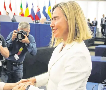  ?? PHOTO: REUTERS ?? Vote winner: Newly elected EU Commission president Ursula von der Leyen is congratula­ted by chief of foreign affairs Federica Mogherin.