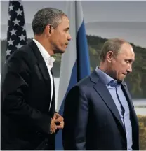  ?? JEWEL SAMAD/ AFP/ GETTY IMAGES ?? U. S. President Barack Obama and Russian President Vladimir Putin emerge from a two- hour meeting at the G8 summit in Northern Ireland on Monday, where they agreed to a goal of reducing violence and chemical weapons use in Syria.