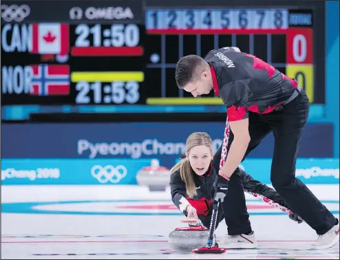  ?? MICHAEL BURNS/PHOTO ?? Canada’s Kaitlyn Lawes throws and John Morris sweeps as mixed doubles curling makes its Olympic debut Thursday.
