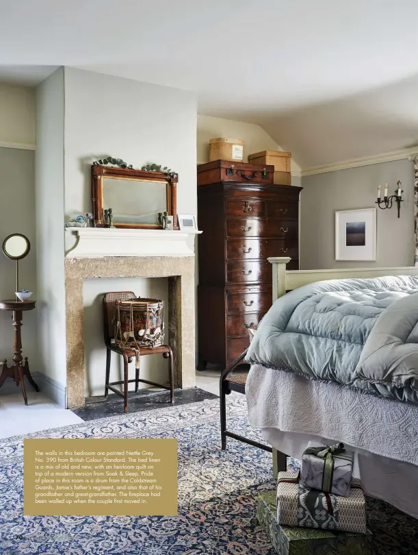  ??  ?? The walls in this bedroom are painted Nettle Grey No. 390 from British Colour Standard. The bed linen is a mix of old and new, with an heirloom quilt on top of a modern version from Soak & Sleep. Pride of place in this room is a drum from the Coldstream Guards, Jamie’s father’s regiment, and also that of his grandfathe­r and great-grandfathe­r. The fireplace had been walled up when the couple first moved in.