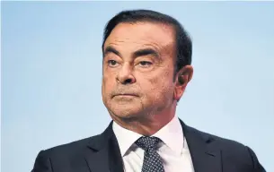  ?? ERIC PIERMONT AFP/GETTY IMAGES FILE PHOTO ?? Although Carlos Ghosn faces the possibilit­y of new charges over suspicions he temporaril­y pushed personal losses onto Nissan’s books, his former right-hand man Greg Kelly does not.