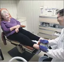  ??  ?? CAROL RICHARDS is treated by Dr. Thomas Lim at Sunset Foot Clinic, which is moving because its lease wasn’t renewed.