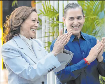  ?? Alejandro Granadillo The Associated Press ?? Vice President Kamala Harris, left, and Frankie Miranda, Hispanic Federation president, applaud, during a visit Friday in San Juan, Puerto Rico.